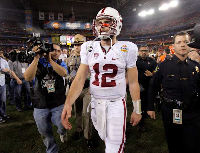 Stanford's Andrew Luck (12) walks of the field after losing the Fiesta Bowl between the Oklahoma State University Cowboys (OSU) and the Stanford Cardinal at the University of Phoenix Stadium in Glendale, Ariz., Tuesday, Jan. 3, 2012. Osu101